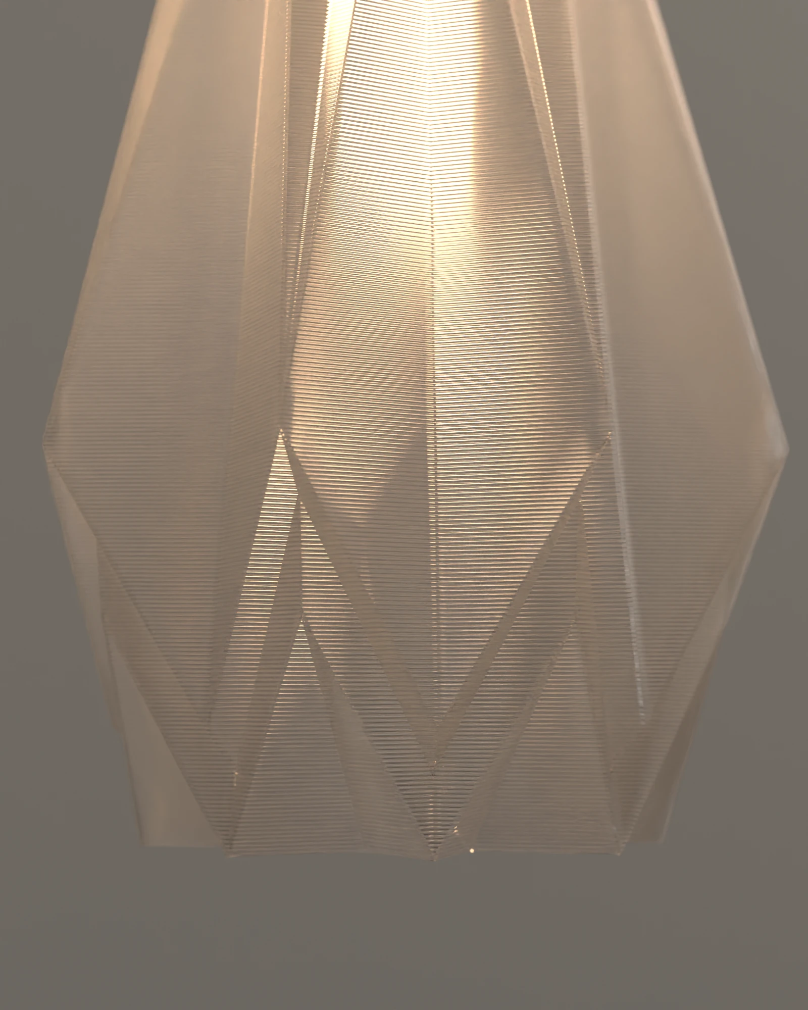 Detalle de las caras de la Lámpara GAMI Transparente, encendida